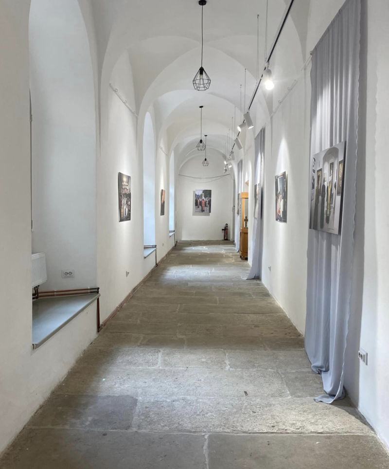 Museum corridor with pictures on the walls